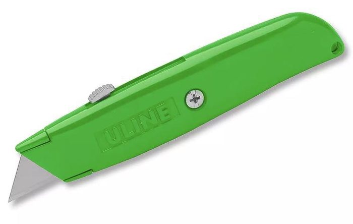 Utility knife with retractable blade and green plastic handle