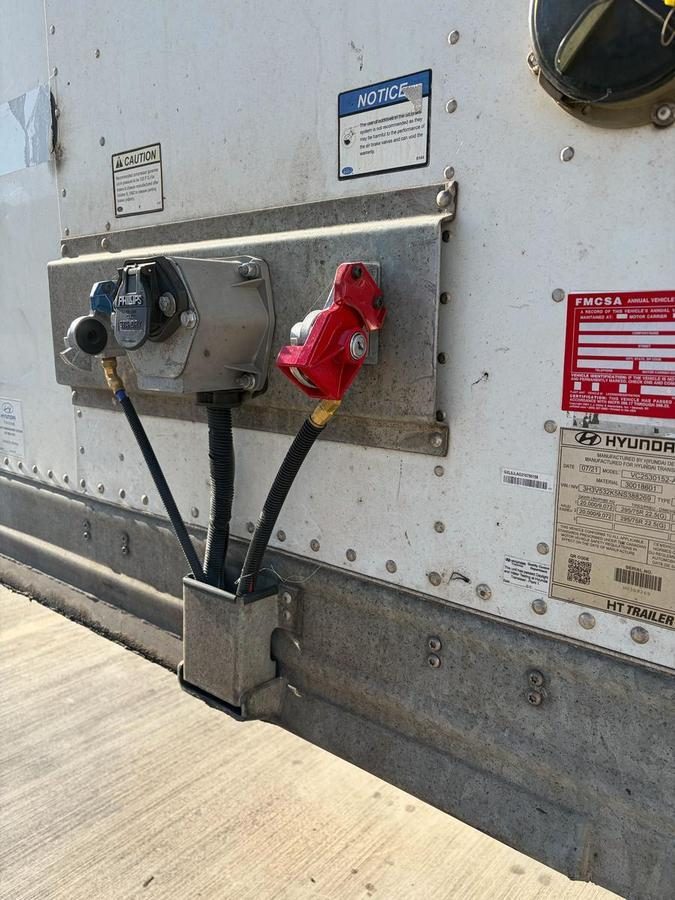 Trailer electrical connection panel with power cord and connectors mounted