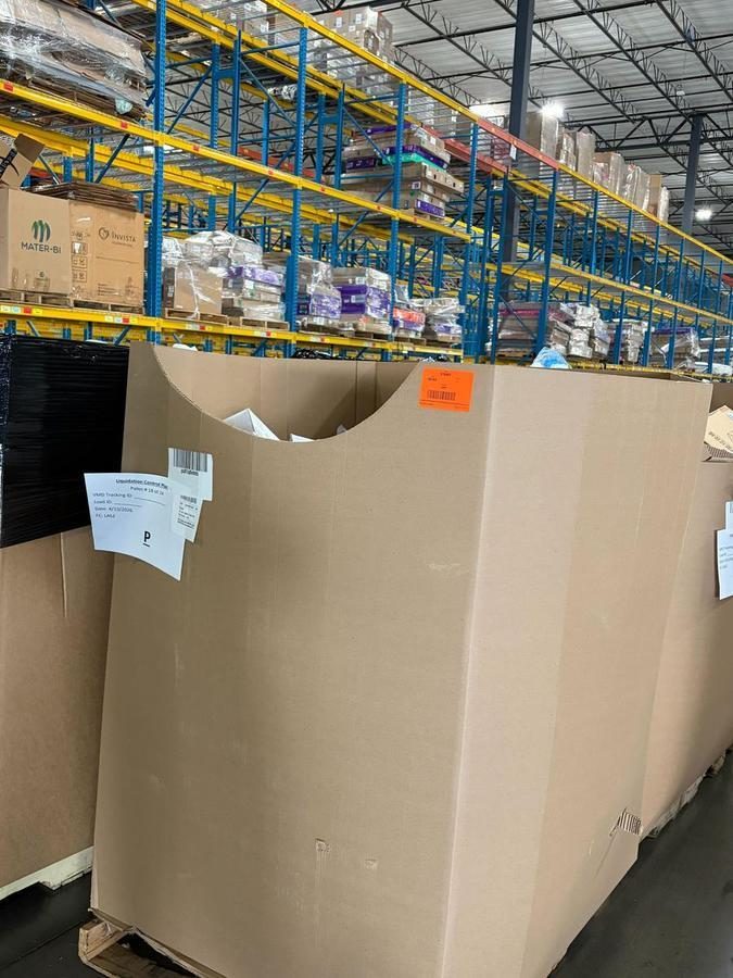 Large cardboard bulk container in warehouse with yellow pallet racking