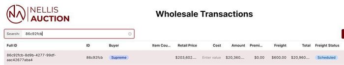 Wholesale transactions table displaying auction lot details and pricing information