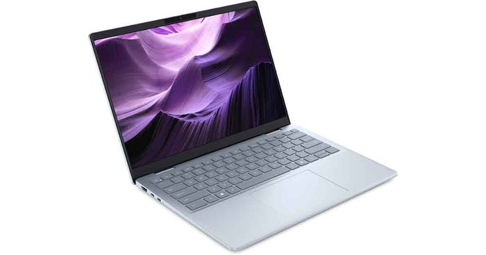 Laptop computer displaying purple abstract wallpaper on screen