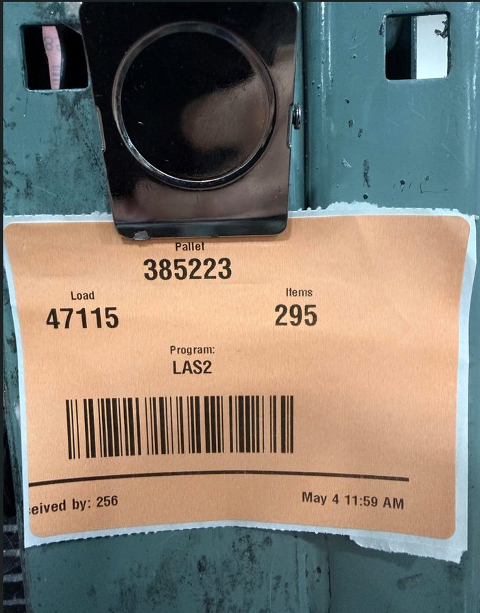 Pallet label showing load number, item count, and barcode information
