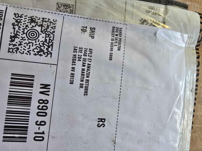 Shipping label with QR code and barcode on package