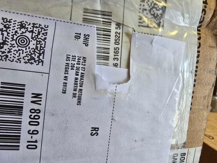 Shipping label with barcode and tracking information on package
