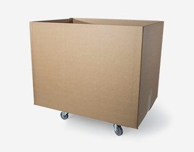 Cardboard shipping box with casters for warehouse transport
